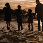 Family walk at sunset